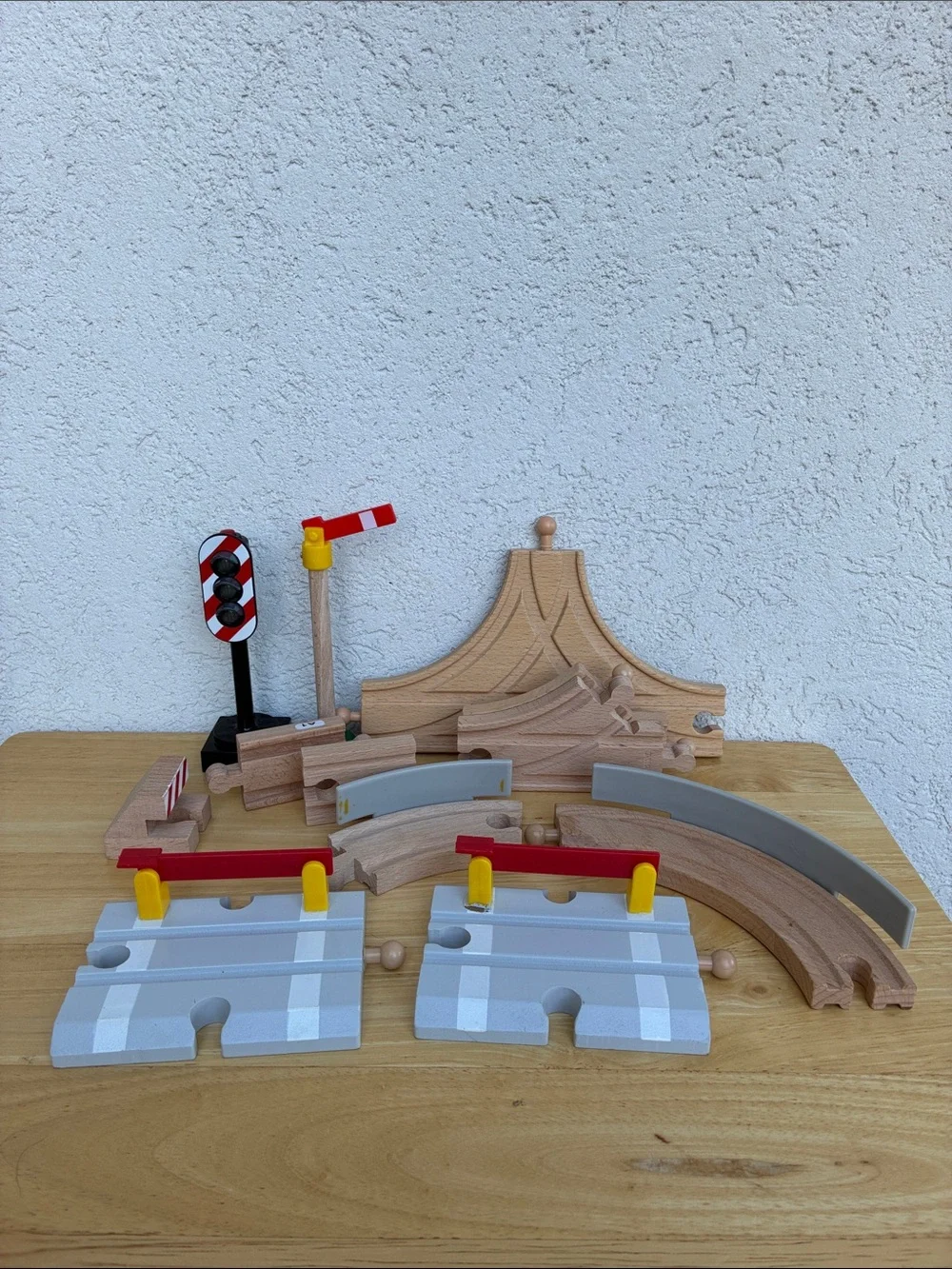 Wooden train tracks and light  Lot of 12 pieces. Great addition to your set!